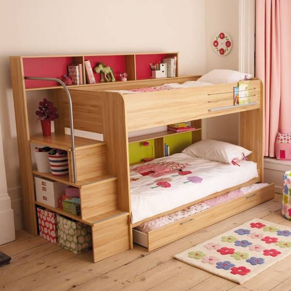 a child's bedroom with a bunk bed and bookcase in the corner next to a window