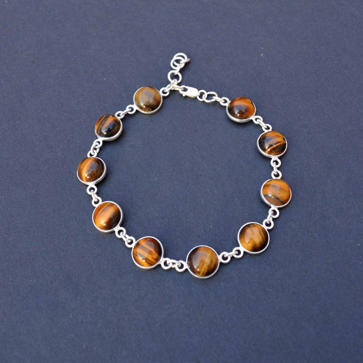 Round Tiger Eye Crystal And 925 Sterling Silver Handmade Bracelet, Natural Gemstone And Solid Silver Jewelry, Hypoallergenic And Tarnish Free, Lightweight And Comfortable Metal : 925 Sterling silver  Gemstone : Tiger Eye Ideal For: Men, Women, boys, Girls  World Wide Free Shipping. Shipping Services -USPS, UPS, DPD, and ECOM. Order Below 150 USD Will Ship Through USPS. (8 To 25 Working Days Delivery) It depends on your country customs clearance. Processing Time-  Your order will be handmade and Sterling Silver Chain Bracelet With Round Beads For Gift, Silver Polished Beads Gemstones For Gift, Silver Beaded Bracelet Jewelry, Adjustable Polished Beads Sterling Silver Bracelet Gift, Gift Sterling Silver Bracelets With Polished Beads, Adjustable Sterling Silver Bracelet With Polished Beads For Gift, Adjustable Sterling Silver Bracelet With Polished Beads, Silver Beaded Gemstones For Gift, Adjustable Polished Beads Sterling Silver Bracelet