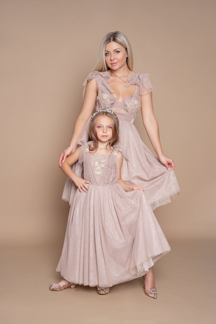 Special occasion matching outfit for mother and daughter will not leave anyone without compliment! Made from finest Italian silk and tulle and hand embellished  with crystal beads. Side zipper on girl's dress. Mother dress consist of corset and skirt and can we worn separately. Mother corset is adjusted with lace in the back. Many layers of tulle on both dresses. Festive Sleeveless Princess Dress For Wedding, Sleeveless Princess Dress For Wedding And Festive Occasions, Festive Sleeveless Wedding Princess Dress, Bridesmaid Pageant Dress With Fitted Bodice Ball Gown, Princess Style Tutu Dress For Bridesmaid, Princess Tutu Dress For Bridesmaids, Princess Tutu Bridesmaid Dress With Fitted Bodice, Elegant Wedding Tutu Dress With Sequins, Elegant Pink Bridesmaid Dress For Pageant