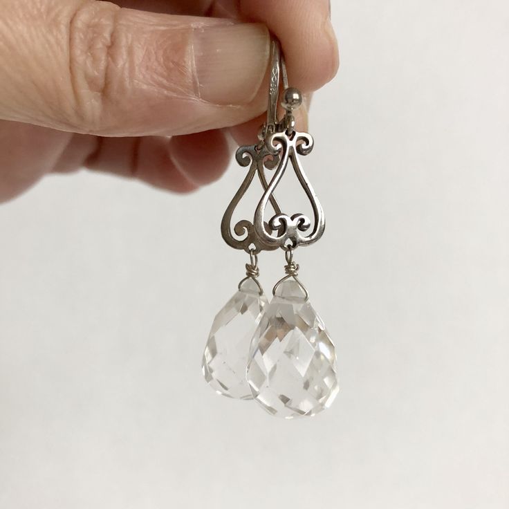 If you LOVE long dangly earrings these are for you! The quartz crystal reflects light beautifully and will brighten up any winter day. Finding: 3/8" x 1/2" Drops: 1/2" Total length: 2" *Please understand it may be color difference sometimes due to the flashlight and the setting of each monitor. All my jewelry is handmade with love and care. PLEASE NOTE: Since gemstones are natural materials, stone colors and shape may vary slightly from the picture, making this beautiful handmade item unique just like you! I always try to describe everything as accurately as possible -- in words and photos. CARE INSTRUCTION: Buff with a jewelry polishing cloth to keep jewelry shining! Or allow it to slowly take on a nice antique look. Return them to a shine whenever you choose. Store in a plastic zip-lock Nickel Free Silver Teardrop Crystal Earrings, Silver Crystal Earrings With French Hook For Gifts, Sterling Silver Chandelier Earrings With Lever Back As Gift, Nickel Free Teardrop Crystal Earrings For Anniversary, Sterling Silver Teardrop Chandelier Earrings Nickel Free, Nickel Free Sterling Silver Clear Earrings, Sterling Silver Dangle Crystal Earrings, Classic Hypoallergenic Dangle Crystal Earrings, Sterling Silver Drop Crystal Earrings