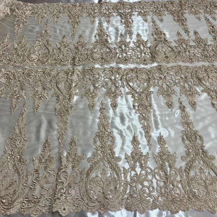 Introducing our luxurious Corded Bridal Lace Fabric Embroidered on 100% Polyester Net Mesh! Perfect for your wedding day, a special evening out or a spectacular dance routine. Let this elegant corded lace make all your special occasions a one-of-a-kind affair. This is the highest quality Corded Couture Lace you’ll find anywhere - we guarantee it! Boasting a distinct look, this exquisite fabric presents a beautiful decorative Corded Lace motif that is sure to add a touch of class and sophisticati Elegant Wedding Dress With Resham Embroidery For Festive Occasion, Gold Embroidered Wedding Dress For Reception, Gold Wedding Dress With Resham Embroidery For Reception, Organza Wedding Dress With Intricate Embroidery For Ceremony, Ceremony Wedding Dress With Intricate Embroidery In Organza, Wedding Pearl Embroidered Fabric In Traditional Drape, Wedding Pearl Embroidered Traditional Drape Fabric, Elegant Organza Wedding Dress With Floral Embroidery, Gold Wedding Dress With Intricate Embroidery For Reception