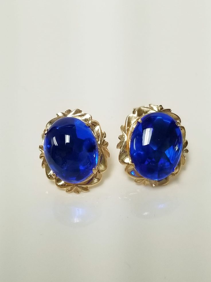 "Thanks for shopping our vintage estate store. We tend to sell well below wholesale and truly hope you enjoy all of our items. Many of the items are one of a kind, so please enjoy scrolling through the pictures and hopefully something will catch your eye. Brown spots are from camera or reflections. Nice estate 18k yellow gold natural 6ct blue spinel stud earrings. Assuming these are spinel, testing spinel, but a lot of these types of gems will test natural and may even be created. Size: 1/2\" by 3/8\" Blue Gem: 11mm by 8mm Weight: 3.29 grams Gems: 3ct each blue gem Marked 18k and these are stunning. These are antique earrings." Types Of Gems, Blue Spinel, Brown Spots, Blue Gems, Antique Earrings, Earrings Vintage, Jewelry Earrings Studs, Vintage Earrings, Vintage Antiques