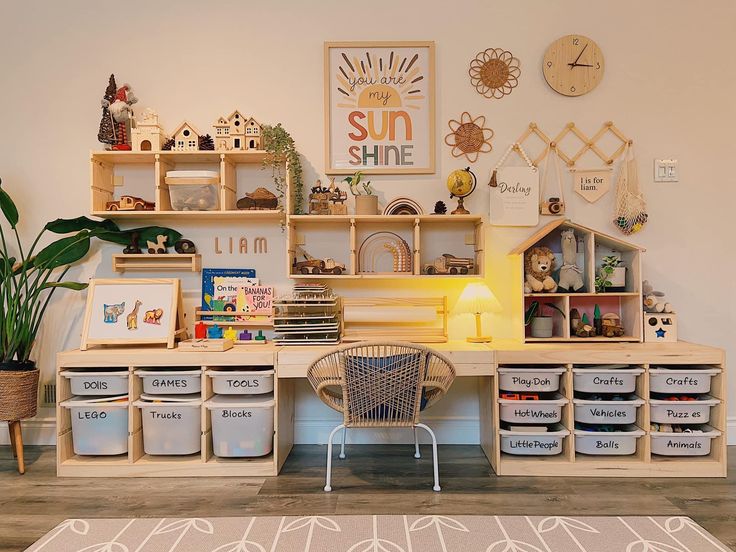 a child's playroom with toys, bookshelves and storage bins