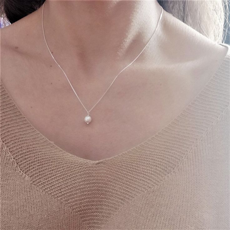 "Timeless, Simple & Delicate Bridesmaid Pearl Necklace in Sterling Silver 925. Looking for: - a Stunning Pearl Necklace for every day wear - a Gift for your Bridesmaids or - a Feminine Elegant Necklace for Her as a gift Whatever the reason may be, this pearl necklace is perfect for every occasion. This pearl necklace is the PERFECT GIFT for every Woman. So delicate and feminine. We use only HIGH QUALITY materials and offer guarantee on our necklaces. We are a 5-Star Seller. Check our reviews and Simple Pearl Necklace As Gift, Simple Silver Necklaces For Mother's Day, Silver Pearl Necklace Gift For Mother's Day, Silver Pearl Necklace For Mother's Day Gift, Elegant Delicate Chain Jewelry For Birthday Gift, Minimalist Silver Necklace For Birthday Gift, Simple Pearl Necklace With Clavicle Chain As Gift, Delicate Clavicle Chain Jewelry For Birthday Gift, Silver Pearl Necklace With Clavicle Chain As Gift