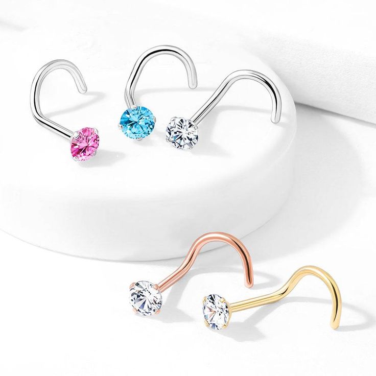 Embrace timeless elegance and unbeatable quality with our Surgical Steel Nose Ring Screw Stud. Crafted from premium 316L Surgical Steel, this nose ring boasts both strength and biocompatibility, ensuring a comfortable and safe fit for your piercing. The PVD plating not only enhances its durability but also adds a lustrous finish, available in classic silver, radiant gold, and chic rose gold. With a gauge of 20 and a length of 1/4" (6mm), this nose ring screw stud offers a perfect balance between Diamond White Round Piercings For Wedding, Classic Round Wedding Piercings, Elegant Silver Nose Ring With Prong Setting, Hypoallergenic Nose Rings For Wedding, Classic Round Internally Threaded Nose Studs, Round Nose Studs With Prong Setting For Anniversary, Round Anniversary Nose Studs With Prong Setting, Anniversary Round Nose Studs With Prong Setting, Anniversary Silver Nose Ring With Prong Setting