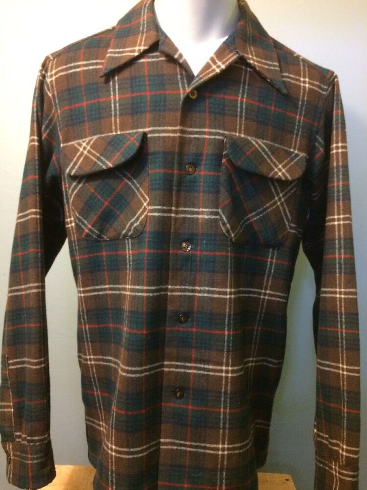 Preowned vintage men's 1970s-1980s, unique and stylish, Pendleton brand, brown green red, 100% wool, shadow box plaid, flap-pocket loop-collar camp board shirt made in USA. Classic retro old-school, dressy and sporty, Rockabilly VLV beach boy-surfer, skateboarding, hot-rod club-car, hunting camping, hiking long-sleeve button up. Light wear, good condition, see pics. Guys Vtg size Medium. Pit-pit 22" across front. Shoulder-hem 29". Back across shoulders 18". Sleeve 24.5". Please compare measureme Retro Button-up Flannel Shirt, Retro Collared Flannel Shirt, Vintage Winter Shirt With Pockets, Vintage Button-up Flannel Shirt With Pockets, Vintage Flannel Button-up Shirt With Pockets, Vintage Plaid Flannel Shirt With Pockets, Vintage Flannel Shirt With Snap Buttons For Fall, Vintage Fall Flannel Shirt With Snap Buttons, Retro Fall Shirt With Pockets