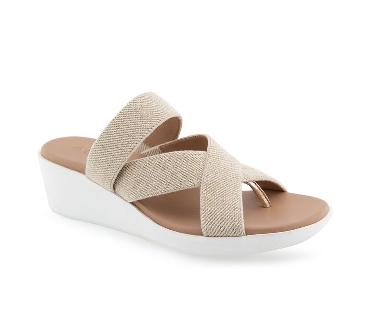 Say hello to Aerosoles Ilona: the sunny-side-up of sandals! This molded unit wedge gives you added height without the extra weight. Plus, youll be feeling cushioned bliss with the footbed inset and multi-strap elastic thong - youll be saying ahhhhh with every step! Get ready to strut your stuff and bring the sunshine wherever you go! Elastic Fabric upper, Slip on for easy entry,2\ wedge heel, Round open toe with thong post, Synthetic padded footbed, TPR outsole | Women's Aerosoles Ilona Wedg Summer Synthetic Wedge Sandals With Ortholite Insole, Vacation Beige Wedge Sandals With Arch Support, Adjustable Slip-on Wedge Sandals With Arch Support, Summer Toe Post Wedge Sandals With Arch Support, Beige Synthetic Wedge Sandals With Arch Support, Beach Wedge Sandals With Ortholite Insole, Ortholite Insole Wedge Sandals For Beach, Adjustable Toe Post Wedge Sandals With Arch Support, Summer Wedge Sandals With Cushioned Footbed