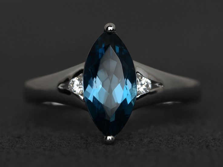 Welcome to my shop, you can find many beautiful gemstone jewelry here, and you also can ask for customized service. Main Stone: London blue topaz, marquise cut, measures 6X12mm, Accent Stones: cz Metal: 925 sterling silver plated with rhodium. I also can provide metal options such as 14k solid yellow/white/rose gold Setting: prong setting More rings please go to my shop home: https://www.etsy.com/shop/XCjewelryStudio?ref=hdr_shop_menu It's a perfect gift for the person who was born in November ( Marquise Cut Topaz Ring For Anniversary, Anniversary Marquise Topaz Ring With Accent Stones, Marquise Topaz Ring For Promise Occasion, Elegant Marquise Cut Blue Topaz Ring, Marquise Topaz Ring With Prong Setting For Promise, Marquise Topaz Promise Ring, Marquise Cut Topaz Ring With Accent Stones For Anniversary, Marquise Blue Topaz Rings For Anniversary, Marquise Blue Topaz Ring With Accent Stones