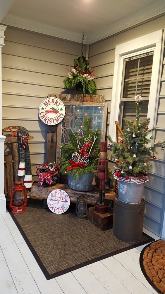 the front porch is decorated for christmas with holiday decorations and other things to put on it