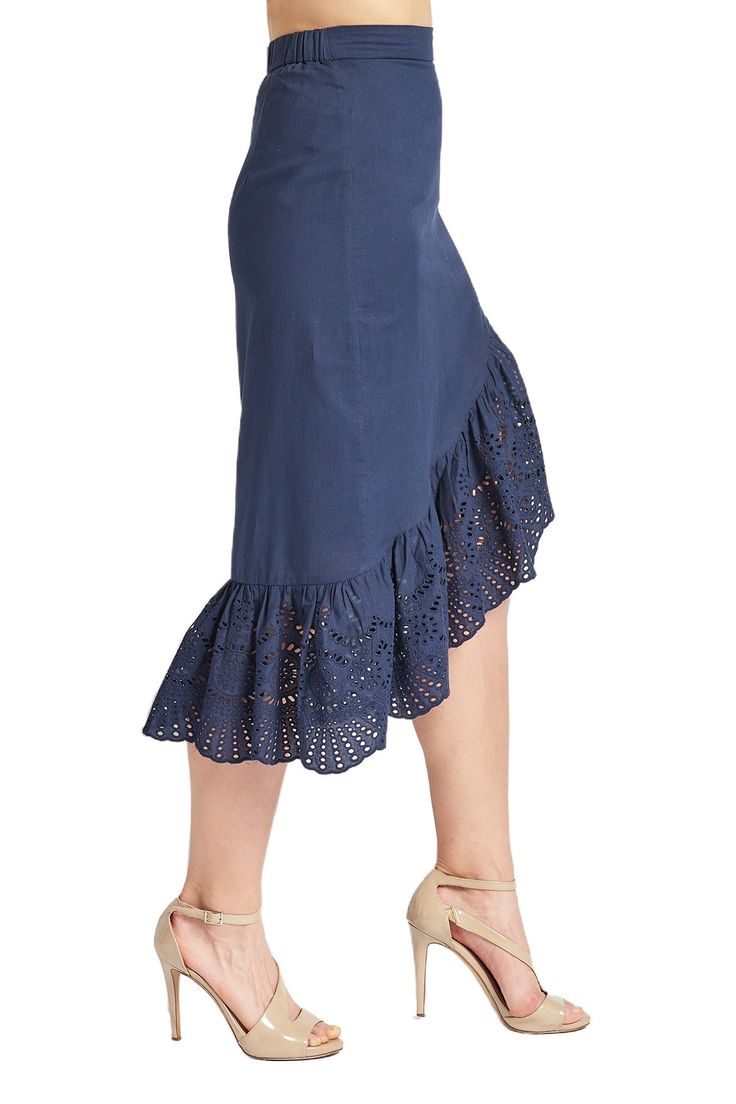 Model wearing navy cotton eyelet off the shoulder top and navy asymmetric eyelet ruffle hem skirt. Spring Cotton Skirt With Asymmetrical Hem, Spring Ruffled Skirt With Handkerchief Hem, Cotton Asymmetrical Skirt For Beach, Spring Skirt With Ruffled Handkerchief Hem, Cotton Skirt With Ruffle Hem For Brunch, Cotton Skirt With Asymmetrical Hem For Spring, Spring Ruffled Handkerchief Hem Skirt, Spring Bottoms With Asymmetrical Hem And Gathered Skirt, Chic Cotton Skirt With Asymmetrical Hem