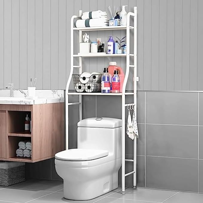 a white toilet sitting next to a wooden shelf filled with bathroom items on top of it