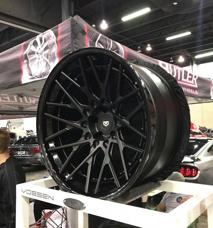 the wheels on display are all black and have red lettering that reads, winter tires