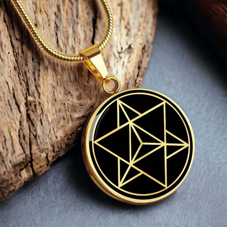 This Star Tetrahedron Merkabah necklace Is the Perfect Gift for all those sacred geometry lovers! Whether for Yourself or a Loved One.  Explore all our sacred geometry jewelry here: https://www.etsy.com/in-en/shop/SymbolicPresent?ref=simple-shop-header-name&listing_id=877238359§ion_id=22613481 ➜ Our jewelry is made of high-quality surgical steel with a shatterproof liquid glass coating and an 18k gold finish option. ➜ Engrave onto the back of the Merkabah pendant your loved one's name, your wedd Star Tetrahedron, Sacred Geometry Jewelry, Geometry Jewelry, Schmuck Gold, Tally Hall, You Are Blessed, Glass Coating, Luxury Necklace, Circle Pendant