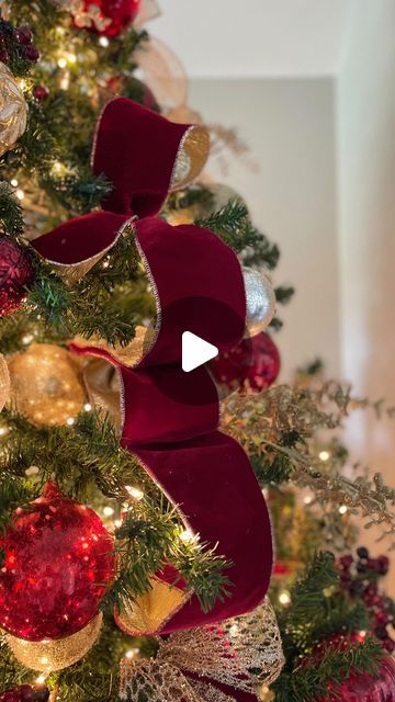 a christmas tree decorated with red and gold ornaments