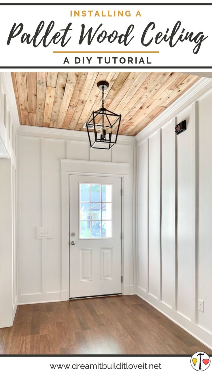 the inside of a room with white walls and wood ceilings, including a light fixture