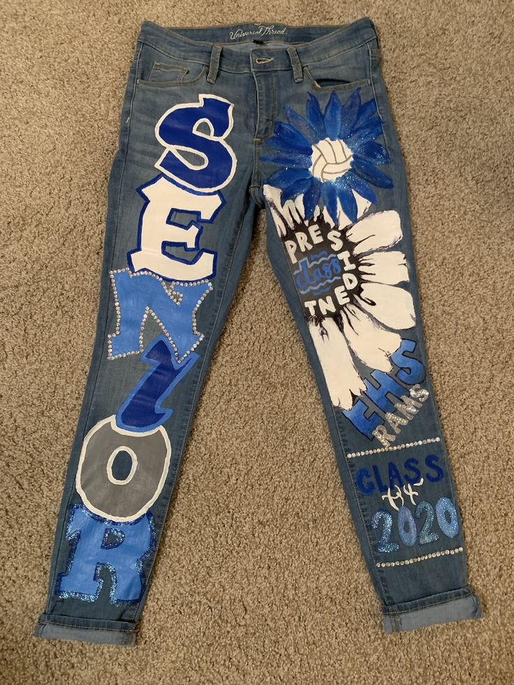 Homecoming Jeans Class Of 2024 Homecoming Shirts, Customized Senior Jeans, Jean Senior Painting, Painted Jeans For School Spirit, Homecoming Spirit Day Outfit, Class Of 2024 Painted Jeans, Black Out Homecoming Week, Class Of 2023 Pants, Celeberty Day Spirit Week Ideas