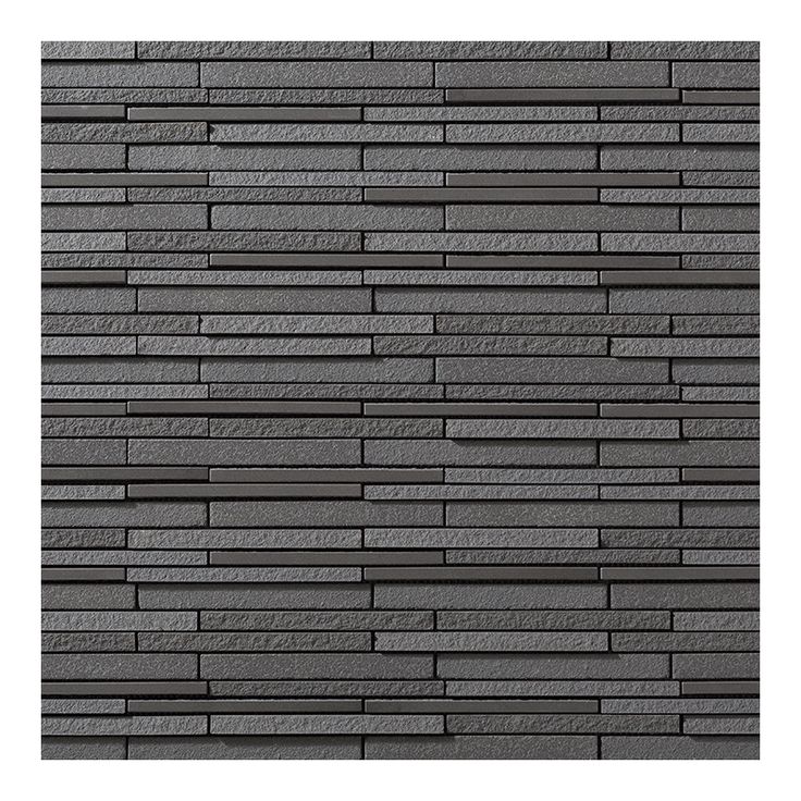 a black brick wall that is made out of grey bricks