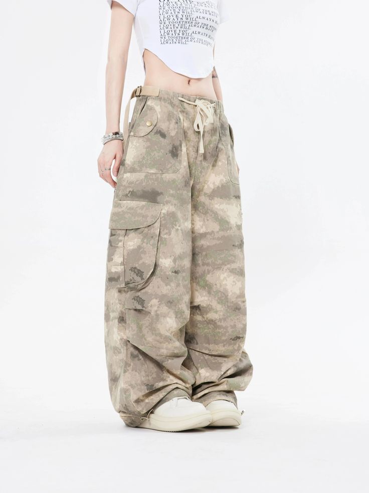 Embrace the street aesthetic with our Faded Baggy Camo Cargo Pants, perfect for making a statement while on the move.
Designed with a natural waist, these cargo pants offer a blend of comfort and durability. The camouflage pattern adds an edgy touch, while the drawstring and convenient pockets provide functionality and ease. The relaxed wide-leg silhouette ensures a nonchalant yet purposeful style, tailored for the contemporary wardrobe.
Pair them with a cropped hoodie and sneakers for running e Khaki High Waist Y2k Bottoms, Khaki Y2k High-waisted Bottoms, Y2k High Waist Khaki Bottoms, Baggy Hip Hop Cargo Jeans For Outdoor, Hip Hop Style Baggy Cargo Jeans For Outdoor, Hip Hop Style Cotton Cargo Jeans For Outdoor, Baggy Y2k Cargo Trousers, Baggy Y2k Pants With Multiple Pockets, Y2k Baggy Pants With Multiple Pockets