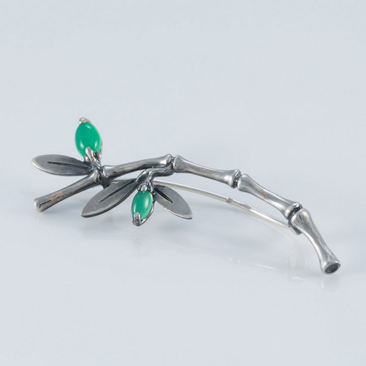 Brooch Bamboo Sterling Silver 925, Cats Eye Pin Brooch, Shawl Brooch for women, Costume Accessories, Fashion Brooches Delicate elegant brooch in the shape of a bamboo, decorated with a natural green cat's eye stone (Chrysoberyl ). Length 5 cm / 1,97 inches When the natural taste and craftsmanship of a designer is combined with carefully selected materials, a real masterpiece is born. Decorating an evening dress, jacket or shawl with a stylish brooch, you will emphasize your impeccable taste and status. The Silver Brooch Bamboo will perfectly complement the outfit of a young lady. he items will be ship by Armenian Postal Service HayPost by Registered Airmail with TRACKING NUMBER. It will be posted in an extremely secure package to make sure its safe arrival at your door. Estimated Delivery Sterling Silver Pendant Brooches Fine Jewelry, Sterling Silver Pendant Brooch Fine Jewelry, Sterling Silver Pendant Brooch In Fine Jewelry Style, Costume Jewelry Brooch For Gift, Fine Jewelry Pendant Brooch, Silver Pendant Brooch Fine Jewelry, Formal Sterling Silver Brooch Jewelry, Formal Sterling Silver Brooch, Anniversary Fine Jewelry Brooch