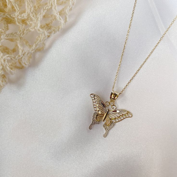 Give her the gift of wings with this beautiful butterfly necklace. DETAILS - 14k yellow gold butterfly with rhodium plating - Chain option is a 14k yellow gold cable chain - Chain style may vary slightly - Approximately 13/16 inch wide x 7/8 inch tall (including bail) VARIATIONS If you require any variation of this style (a different style chain, longer chain, etc.) feel free to message us. We will do our best to accommodate you. Additional costs may apply depending on the variation. POLICY We d Luxury Yellow Gold Butterfly Necklace, Luxury Gold Butterfly Charm Necklace, Elegant 14k Gold Butterfly Necklace, Yellow Gold Butterfly Pendant Necklace In Fine Jewelry, Yellow Gold Wing-shaped Jewelry, Delicate Yellow Gold Necklace With Butterfly Charm, Yellow Gold Pendant Necklace With Butterfly Charm, Delicate White Gold Butterfly Charm Necklace, Yellow Gold Pendant Jewelry With Butterfly Clasp