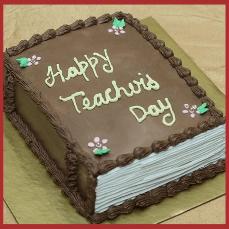 a cake with the words happy teachers day written on it is sitting on a table