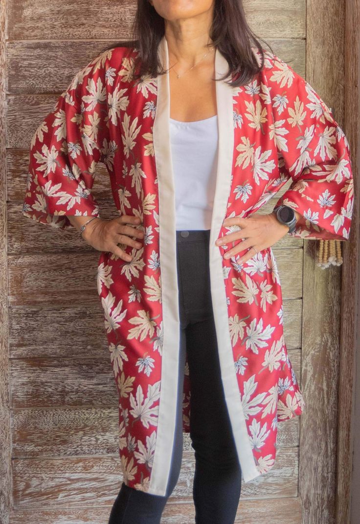 Get ready to dazzle in this stunning red kimono robe! Perfect as a long cardigan or summer top, this versatile piece will elevate any outfit, whether you're dressing up for a rave or getting ready for a special occasion. The flowy design makes it a fabulous beach cover up, ideal for lounging in style. Surprise your wife with this elegant kimono robe as a birthday gift that she'll cherish for years to come. Detail's:  ● Size: All size, please see the details below.  ● Width: circumference 125 cm Red Wrap Kimono For Spring, Red Spring Robe For Loungewear, Red Robe With Kimono Sleeves For Spring, Red Long Sleeve Robe For Summer, Red Long Sleeve Summer Robe, Long Red Summer Robe, Red Wrap Kimono For Festivals, Red Long Sleeve Kimono For Vacation, Red Long Sleeve Kimono For Spring