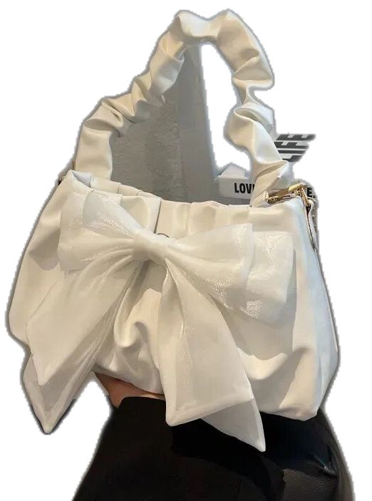 a woman's handbag with a white bow on it