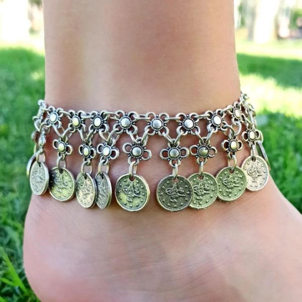 The Ottoman Symbol Anklet is a stunning piece of jewelry that beautifully captures the cultural heritage and artistic legacy of the Ottoman Empire. Made with high-quality materials and expert craftsmanship, this anklet features intricate patterns and symbols that evoke the rich history and traditions of this great civilization. The Ottoman Symbol Anklet is made from durable and hypoallergenic materials, ensuring that it will last for years to come without causing any irritation or discomfort. It Bohemian Metal Anklets For Beach, Bohemian Silver Anklets For Festivals, Silver Bohemian Anklets For Festivals, Handmade Adjustable Anklets, Bohemian Metal Anklets, Bohemian Adjustable Anklets, Bohemian Silver Anklets As Gift, Bohemian Nickel-free Anklets For Festivals, Silver Bohemian Metal Anklets