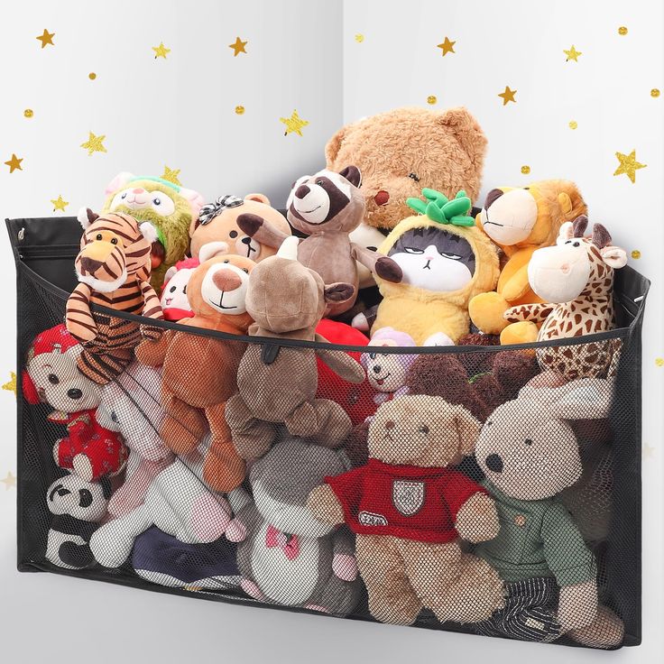 there are many stuffed animals in the bin