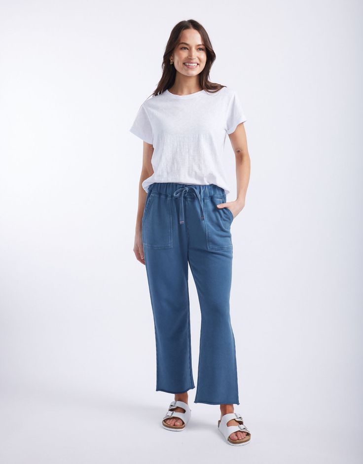 DESCRIPTION Elevate your casual wear with the Raw Edge Lounge Pant in Denim by White & Co. The Label. These lounge pants are designed for ultimate comfort and style, featuring a relaxed fit with a drawstring waist and raw edge hem. The soft denim colour adds a modern touch, while the large front pockets provide both practicality and a chic look. Perfect for lounging at home or running errands, these French Terry pants will become your go-to for effortless, laid-back style. Pair the Raw Edge Loun Casual Wide Leg Soft-washed Bottoms, Casual Soft-washed Wide Leg Pants, Comfortable Straight Leg Pants With Drawstring, Comfortable Straight Leg Bottoms With Drawstring, Everyday Relaxed Fit Drawstring Pants, Everyday Wide Leg Drawstring Pants, Everyday Wide Leg Pants With Drawstring, Relaxed Drawstring Pants For Everyday, Casual Denim Blue Jeans