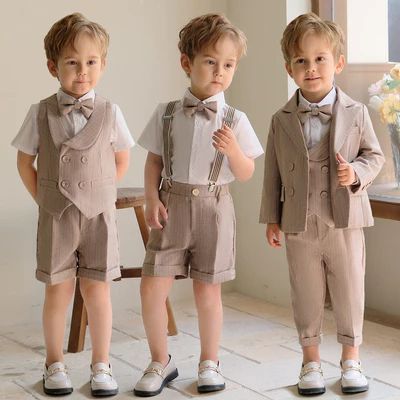 three little boys wearing suits and bow ties