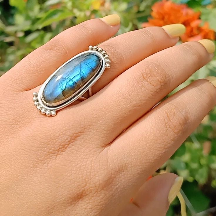 Handmade labradorite  bohemian ring  , you can wear this ring as a party wear ring .. Title -labradorite stone ring  Stone color - blue  Stone shape - oval Material - Sterling silver 925 Note - This is natural stone so shade may be little bit different .. we are giving you best quality rings on best price .. contact us for more quantity Bohemian Moonstone Ring With Large Stone, Bohemian Turquoise Ring With Natural Stones, Bohemian Large Moonstone Ring, Blue Labradorite Bohemian Jewelry, Blue Bohemian Crystal Ring, Bohemian Style Open Crystal Ring Gift, Bohemian Blue Labradorite Jewelry, Bohemian Open Ring Crystal Ring For Healing, Handmade Bohemian Turquoise Ring In Sterling Silver