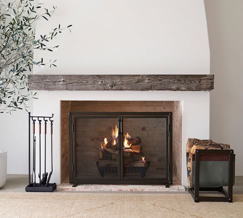 a living room with a fire place and an olive tree