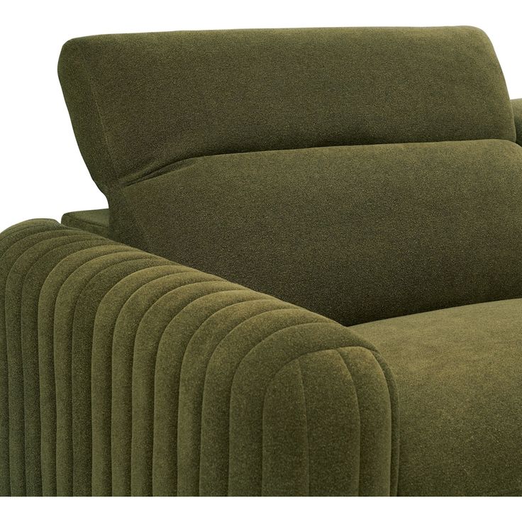 a close up of a green couch with lots of lines on the armrests