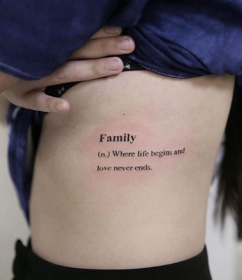 a woman with a tattoo on her stomach that says, family no where life begins and love never ends