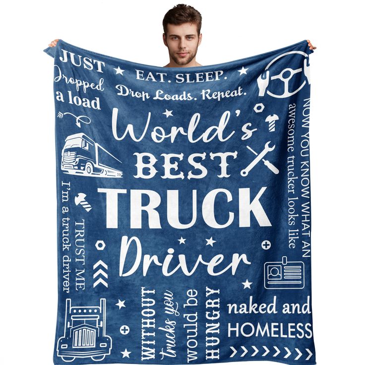 a man holding up a blue blanket that says world's best truck driver