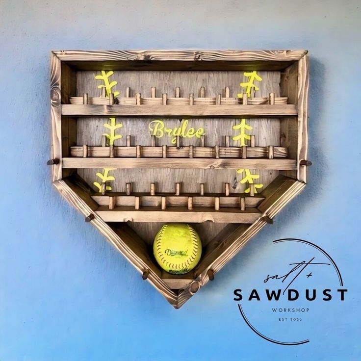 a wooden shelf with a softball inside of it