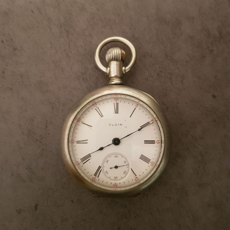 Antique Elgin Natl Watch Co (USA) pocket watch, circa 1899. It comes with blue hands and black roman numerals. Very rare and collectible model. Movement Serial Number:7932938. Grade: 208. Model: 5. Size: 18s. Jewels: 7j. Movement Configuration: Openface. Movement Finish: Nickel. Case: Keystone Watch Case.  Case Grade: Silveroid. Serial Number: 3647203. Measures: 2 1/2'' diameter x 3/4''. Weight: 5.8 oz. Vintage Elgin watch is in good pre-owned condition. No running. Antique Round Pocket Watch With Subdials, Timeless Pocket Watch With Stopwatch Feature As Gift, Classic Round Stopwatch Watch, Timeless Chronograph Pocket Watch For Formal Occasions, Classic Round Watch With Stopwatch, Timeless Chronograph Pocket Watch With Round Dial, Victorian Watches With Subdials As Gift, Timeless Watch With Stopwatch, Timeless Watches With Stopwatch