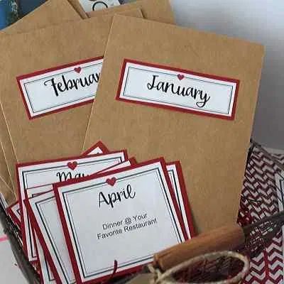 four brown envelopes with red and white labels on them sitting next to each other