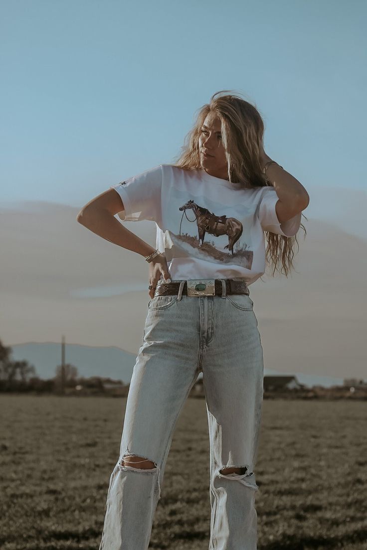 Perfect western tee for a casual look! -Unisex -Double sided -True to size -Dear Rodeo Tees Casual T-shirt For Western-themed Fall Events, Western Style T-shirt For Ranch In Summer, Western Style Summer T-shirt, Casual Summer T-shirt For Ranch, Casual White T-shirt For Western-themed Events, Casual Summer Outdoor T-shirt, Country Style Short Sleeve T-shirt For Rodeo, Country Style Crew Neck Top For Rodeo, Country Style Short Sleeve T-shirt For Ranch