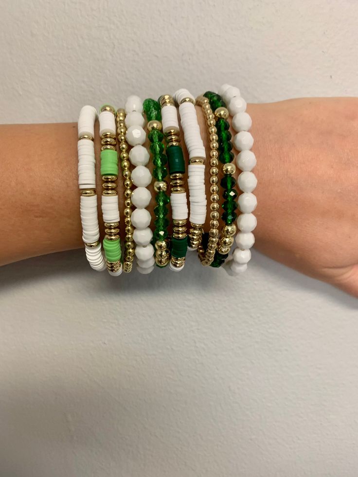 Perfect for St. Patrick's Day! Green Bracelet Stacks. 5 beaded stands per stack. Mutli materials beads on elastic stings.  One size fits all.  Please select the style you would like before proceeding to checkout! Prices are based on bead material and size.  Wear together or separate! Cheap Stackable Green Bracelets, Adjustable Stacked Beaded Bracelets With Round Beads, Adjustable Stacked Round Beaded Bracelets, Adjustable White Stacked Beaded Bracelets, St Patricks Clay Bead Bracelets, Adjustable Stacked White Beaded Bracelets, Green Stackable Beaded Bracelets With Round Beads, White Stacked Stretch Bracelet With Round Beads, St Patricks Day Bracelets