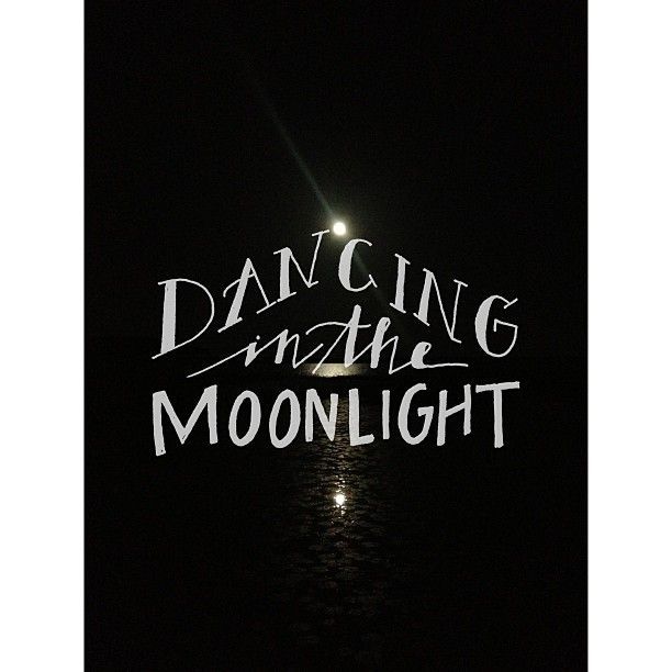 the words dancing in the moonlight are lit up