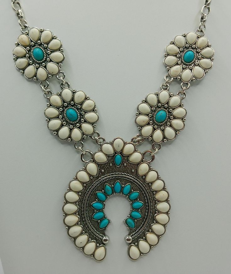 3pcs/Set Turquoise/White Squash Blossom Style Necklace & Stud Earrings Western Jewelry  The Necklace is 16",  Pendant is 3" Long    Necklace has a 3" Extender,   Earrings 1 1/2" Drop White Turquoise Bohemian Necklace, White Southwestern Style Jewelry Gift, Southwestern White Jewelry Gift, Southwestern Style White Jewelry Gift, Southwestern Style White Round Jewelry, Southwestern Style White Nickel-free Jewelry, White Southwestern Turquoise Necklace Gift, Southwestern White Turquoise Necklace Gift, Southwestern Style White Turquoise Necklace As Gift