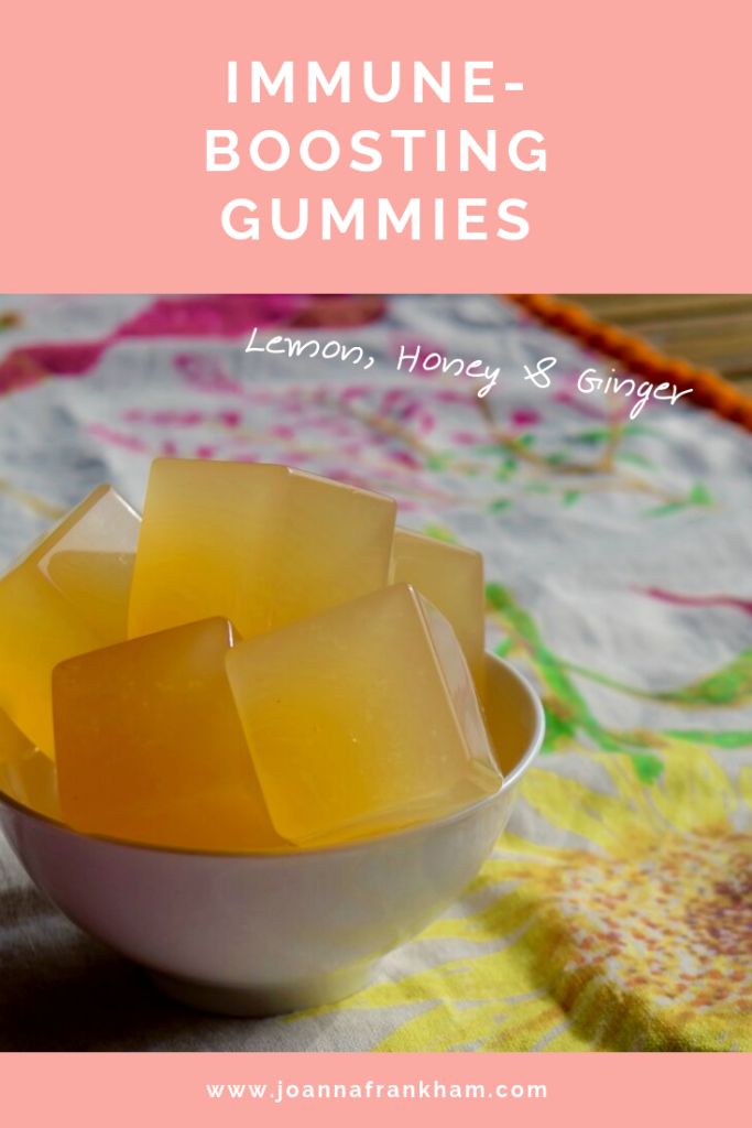 lemon honey and ginger gummies in a bowl with text overlay that reads, immune - boosting gummies