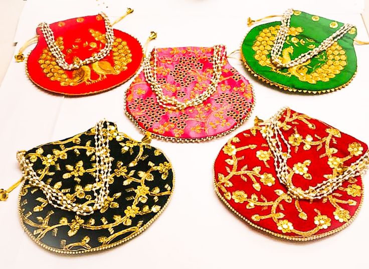 Potli Bag Dimension :- H*L (cm) : 23*24 ) , (H*L: 9* 9.5( Inch) (Handle Dimension :- H* L (cm) 20*14) (Type:-Pearl Drawstring) * Accessibility : Used to carry earrings, rings, bracelets and other jewelry items. Coins, cards with easy accessibility which keeps your items anti-dust. Other usage as storage for necklaces, bangles and other accessories to prevent it from tangling * This Potli Bag is Made From dupion silk , velvet, Product Primary Work at Brocade Patchwork, * Closure : Being lightweig Festive Multicolor Potli Bag With Latkans, Multicolor Handwork Bags For Celebration, Bollywood Style Multicolor Potli Bag For Wedding, Multicolor Handwork Bags For Wedding, Multicolor Potli Bag For Wedding And Navratri, Traditional Multicolor Bags For Celebrations, Multicolor Handwork Wedding Bag, Traditional Potli Bag With Latkans For Celebration, Bollywood Style Multicolor Wedding Bags