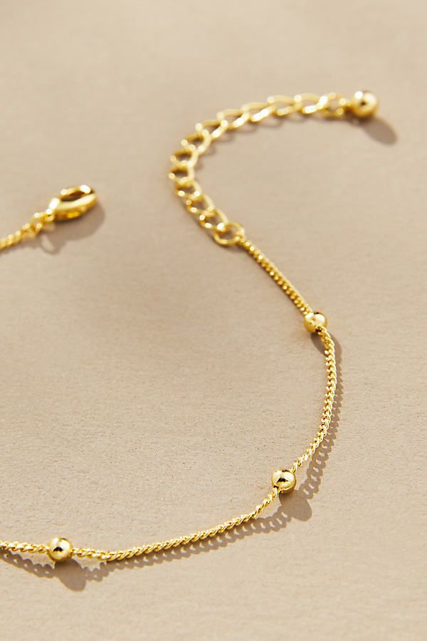 14k gold-plated brass Lobster clasp Imported | Everyday Gold Bracelet by Uncommon James, Women's, Gold/Plated Brass at Anthropologie Everyday Brass Gold-tone Bracelet, Everyday Gold-tone Brass Bracelet, Gold Brass Bracelets With Lobster Clasp, Gold Plated Jewelry With Adjustable Chain And Round Beads, Yellow Gold Chain Bracelet With Gold Clasp, Gold-tone Brass Jewelry With Jubilee Bracelet, Gold Bracelet With Lobster Clasp, Dainty Adjustable Tarnish Resistant Bracelets, Everyday Metal Bracelets With Gold Clasp