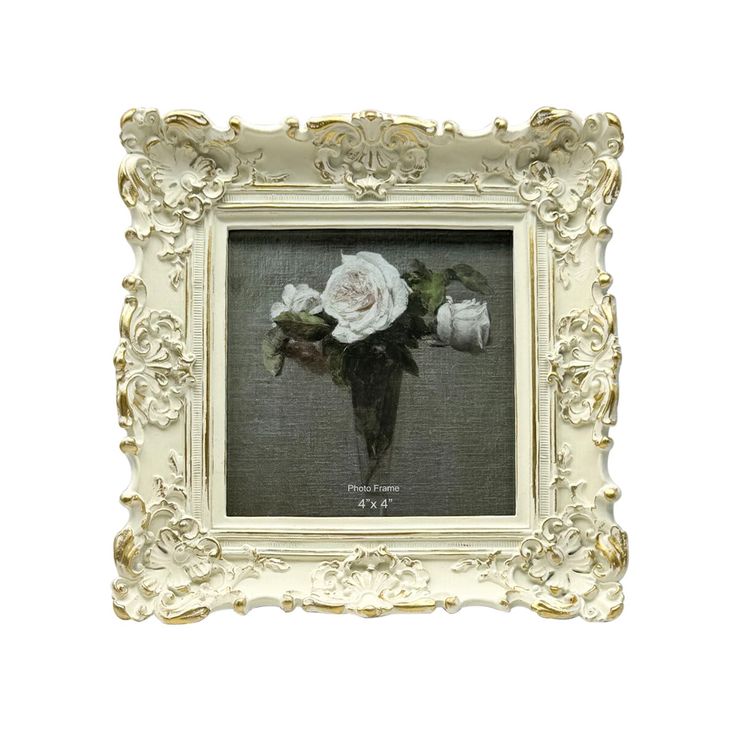 a white frame with a painting of flowers in it