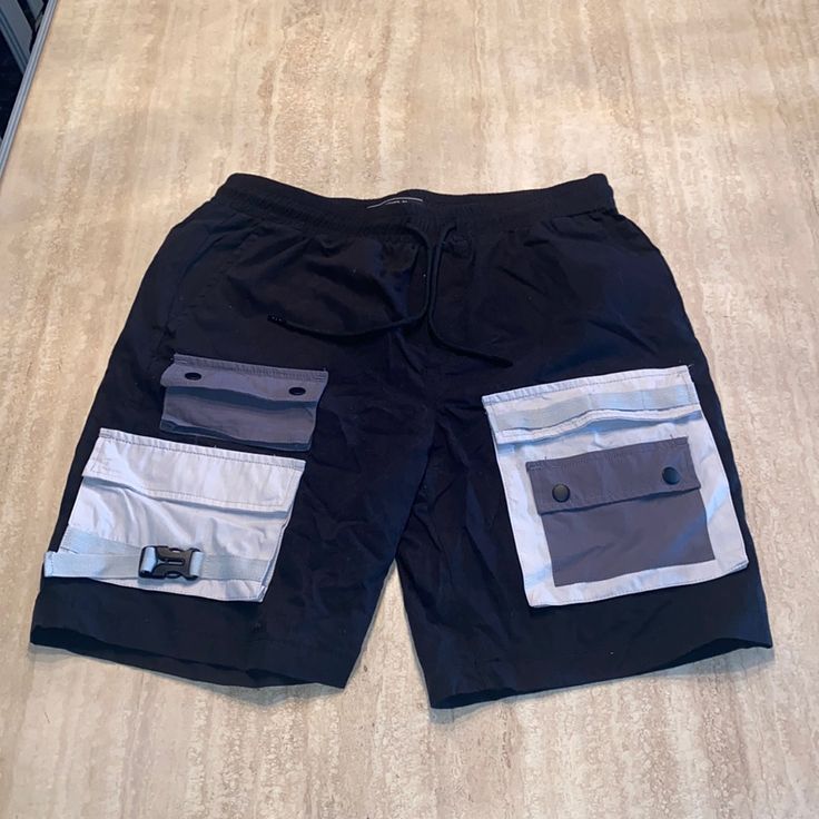 - Cool & Edgy - Cargo Pant With Buckle Detail - Size L Utility Black Shorts For Summer, Black Utility Shorts For Summer, Urban Black Summer Bottoms, Urban Gray Summer Bottoms, Trendy Black Shorts With Pockets, Trendy Black Shorts With Side Pockets, Casual Black Bottoms From Forever 21, Forever 21 Casual Streetwear Bottoms, Forever 21 Black Bottoms For Spring