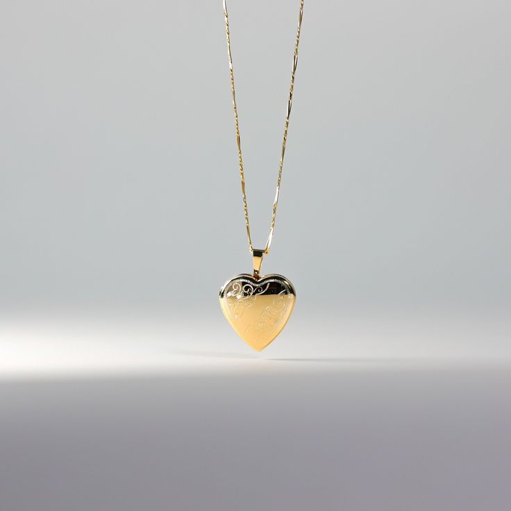 *CHAIN IS NOT INCLUDED. Own a tangible representation of love in the most elegant way. This 14K solid gold heart-shaped pendant is the most sophisticated way of showing love to someone who is dear to your heart. Whether that be yourself or a significant other. This gold heart locket pendant will captivate not only the eyes but also the heart of the person who will receive it. Made from the finest 14K solid gold material, this heart-shaped pendant is a real symbolism of luxury and of love. Make i Formal Polished Heart Pendant Necklace, Heart Cut Locket Necklace With Heart Charm For Anniversary, Heart Cut Locket Necklace For Gift, Anniversary Heart Cut Locket Necklace With Heart Charm, Engraved Double Heart Yellow Gold Necklace, Elegant Heart Charm Locket Necklace For Valentine's Day, Heart Cut Locket Necklace For Wedding, Elegant Hallmarked Heart Pendant Necklace, Anniversary Heart Necklace With Locket