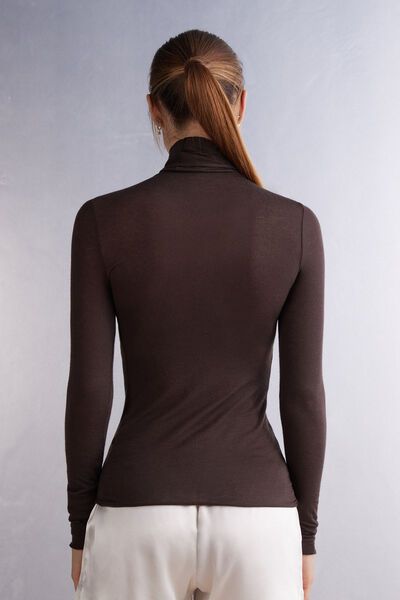 Long-sleeve top in soft modal cashmere ultralight with a high-neck design. Due to transparent nature of ultralight material, we recommend pairing with Ultralight Microfiber Top. Long Sleeve Modal Tops For Fall, Sleek Fine Knit Tops For Fall, Second-skin High Neck Top For Fall, Second-skin Turtleneck Tops For Fall, Casual Seamless Turtleneck Tops, High Neck Solid Color Top For Layering, Sleek Long Sleeve Viscose Tops, Stretch Viscose Long Sleeve Tops, Seamless Long Sleeve Modal Top